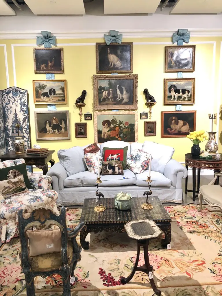 A wall of Cavalier King Charles Spaniel paintings displayed almost exactly as they once hung in Buatta's home. (Photo by Lacelliese King)