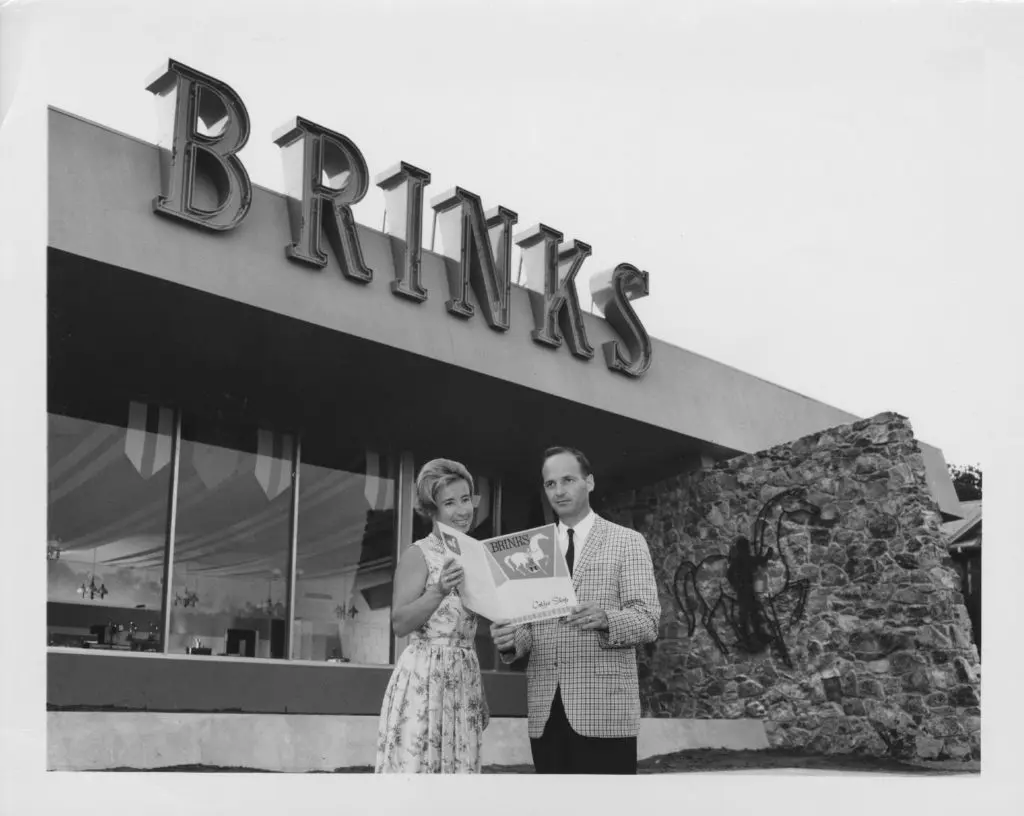 Maureen Connolly-Brinker and Norman Brinker in front of Brinks Coffee Shop. Photo Courtesy of Cindy Brinker and University of Houston Hospitality Industry Archives