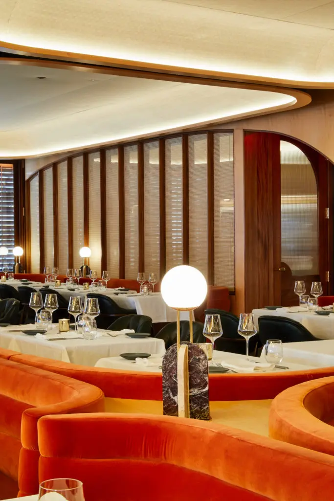 Plush orange seating and wooden accents make Georgie one of the prettiest new restaurants in Dallas.