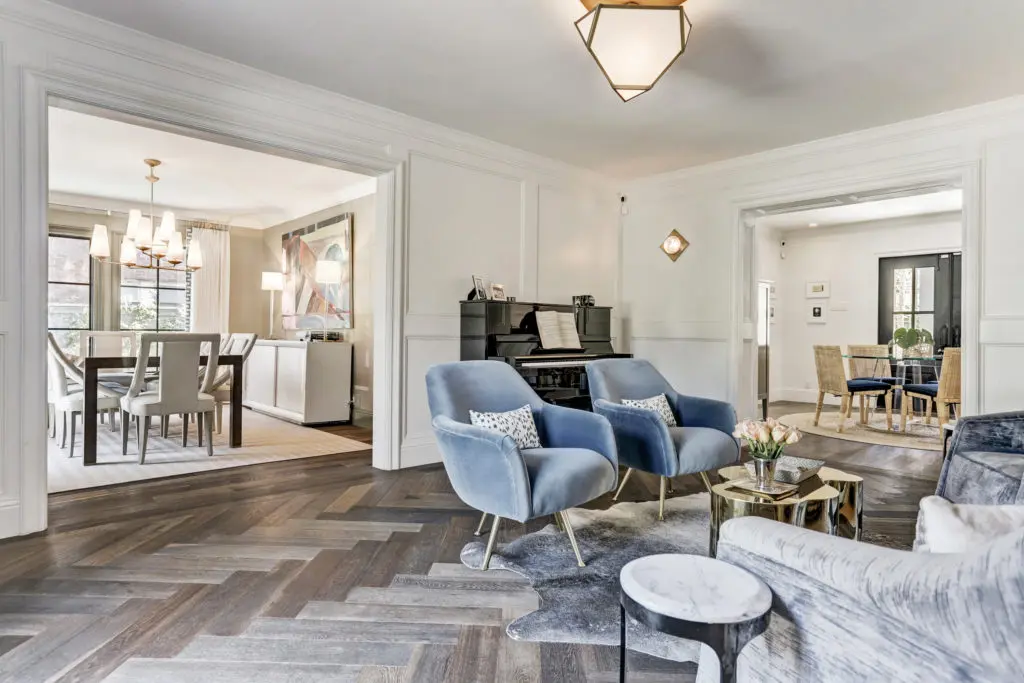 Although the house was built as a duplex in the 1930s, the plan has been updated and opened providing an easly flow from living room to formal dining to the kitchen and family room.  (Photo by TK Images)
