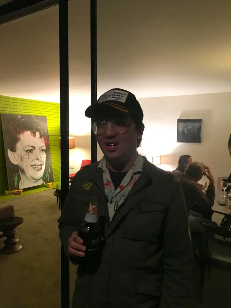 Artist/designer/friend/collector Peter Lee with Michael Bevilacqua's "Judy, Judy, Judy," 2018, on opening night.