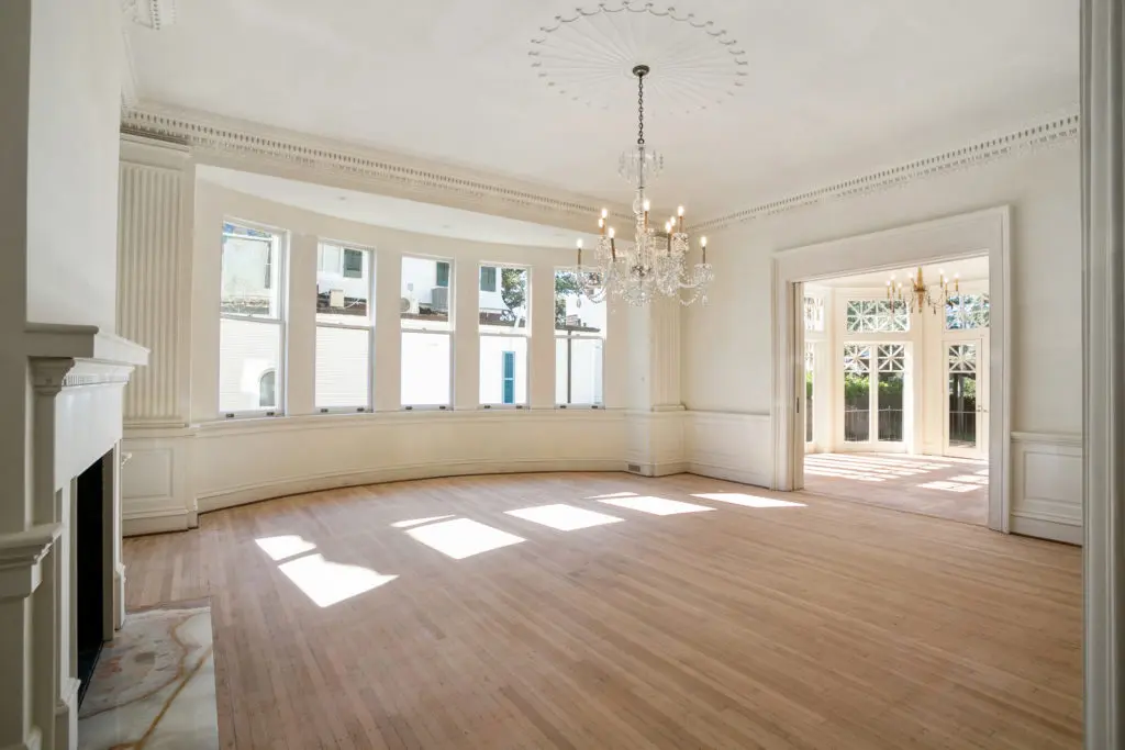 The home features original millwork, grand staircases and sunny spaces, 
