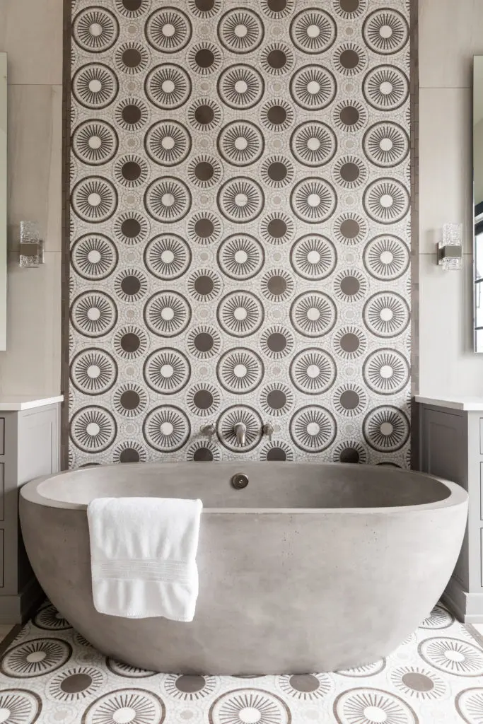 The solid concrete tub in the master bath is a unique touch from NativeTrails. The mixed geometric mosiac adds interest to the setting. (Photo by Jen Burner)