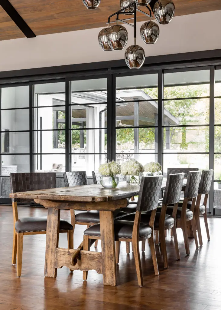 The 100-year-old dining table from Belgium pleasingly contrasts with the contemporary furnishings. (Photo by Jen Burner)