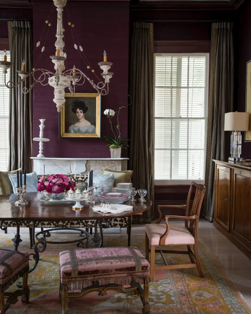 Rich amethyst linen wallpaper in the dining room, which can seat 12. (Photo by Paul Costello)