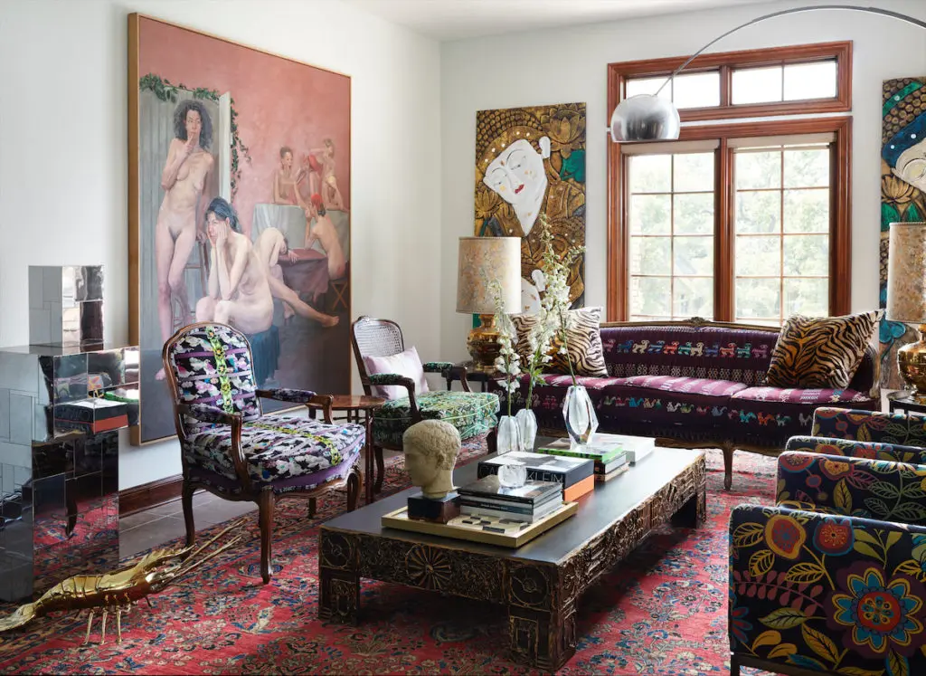 The living room in Bryan Adridge’s office, designed by Judy Aldridge, in Trophy Club includes a rare Paul Evans
sculpture, Adrian Pearsall coffee table, and antique French chairs
upholstered in fabric from Guatemala. The 1978 nudes painting by Jillian
Denby is from Gillian Bryce Fine Art in Tucker, Georgia, an Aldridge favorite. (Photo by Lisa Petrole)