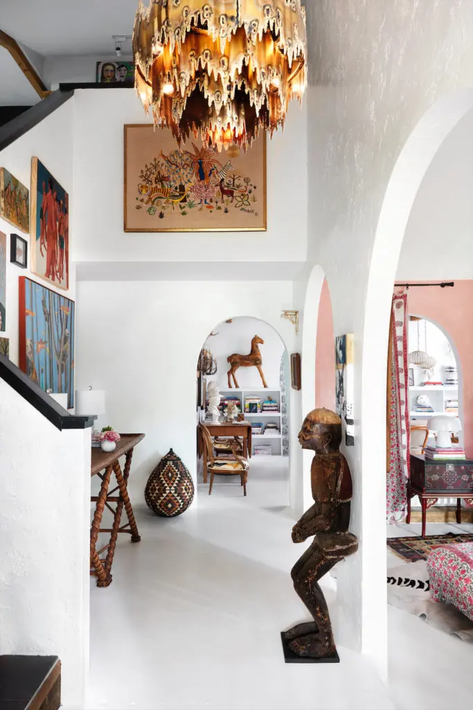 White floors and walls are a dramatic contrast for Judy Aldridge's collection of African artifacts. (Photo by Lisa Petrole)