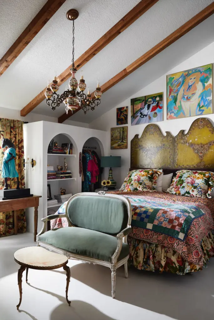 Designed by Judy Aldridge, the master bedroom's king-size headboard is made from a pair of '70s paiper-mâché headboards from Mexico. (Photo by Lisa Petrole)