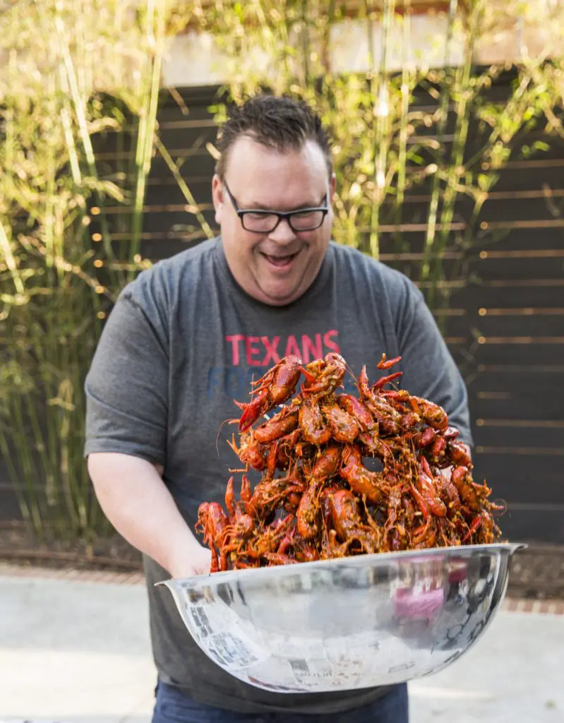 Chef Chris Shepherd displays his crawfish juggling talents at a backyard mudug fest. (Instagram photo)