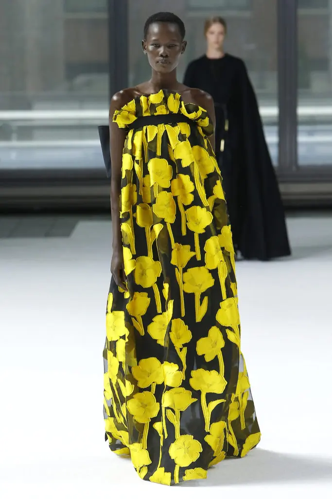 Carolina Herrera goldenrod yellow and black fil coupe strapless ruffle gown, dark green pumps.(Photo courtesy of Carolina Herrera)