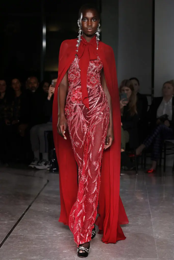 Naeem Khan red sheer beaded gown and cape. (Photo by Dan and Corina Lecca)