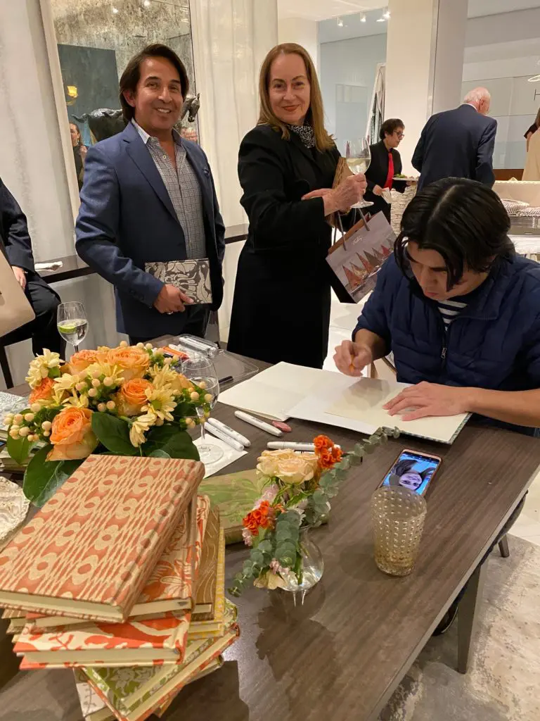 Caricature artist creates portraits in Fortuny gift books at the Donald Sutherland Showroom in the Decorative Center Houston.  (Photo by Shelby Hodge)