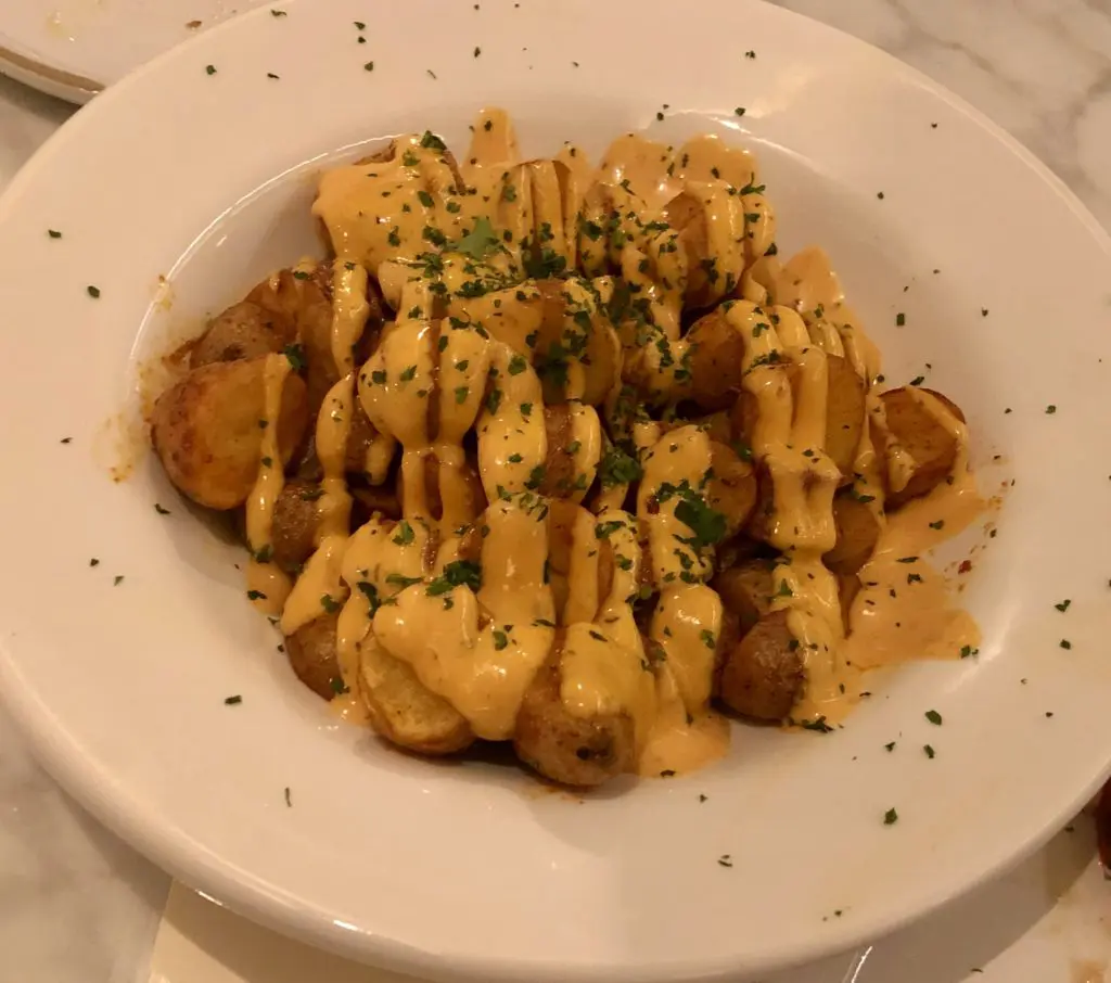 Brave potatoes with secret spicy aioli sauce at Sketches of Spain. (Photo by Megan Ziots)