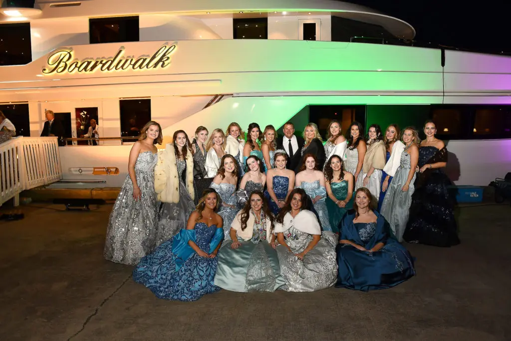 The Knights of Momus duchesses at a pre-San Luis Salute cocktail reception on the dock and on board Tilman Fertitta's yacht, The Boardwalk (Photo by Dave Rossman)