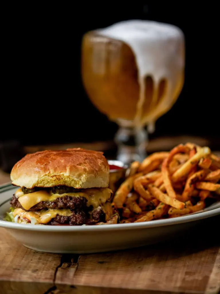 A double cheeseburger and a cold schooner (photo by Brian Hutson).