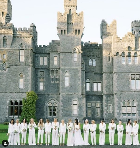 Cristina Ottaviano broke with tradition when she designed all-white suits with wide-legged pants for the 17 attendants at a castle wedding in Ireland — and the bridal gown, too. (Instagram: @cristinaottaviano)