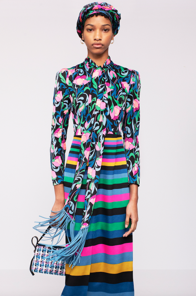 Kate Spade floral tie blouse with fringe trim, striped skirt, tweed handbag. (Photo by Andres Burgos )
