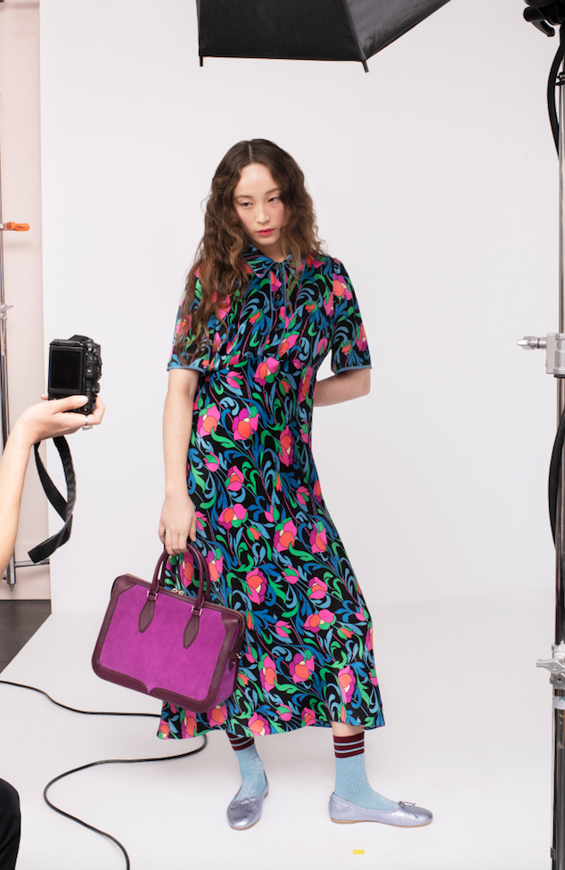 Kate Spade floral dress, two-tone top handle handbag. (Photo by Andres Burgos )