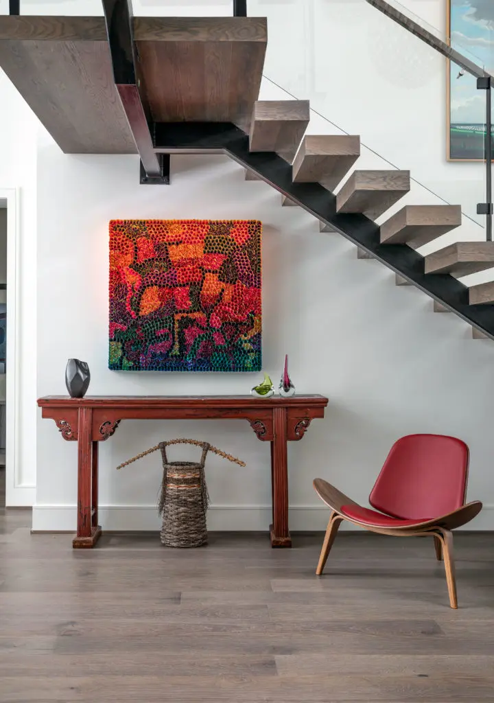 The dramatic painting beneath the staircase is by Zhuang Hony Yi. (Photo by Kerry Kirk)