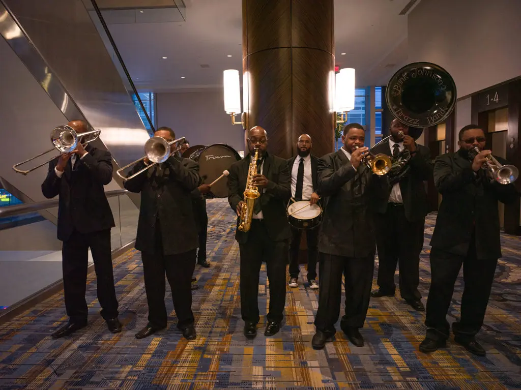 Bunk Johnson and his Brazz Band lead the second line parade through the hotel ballroom. (Photo by Daniel Ortiz)