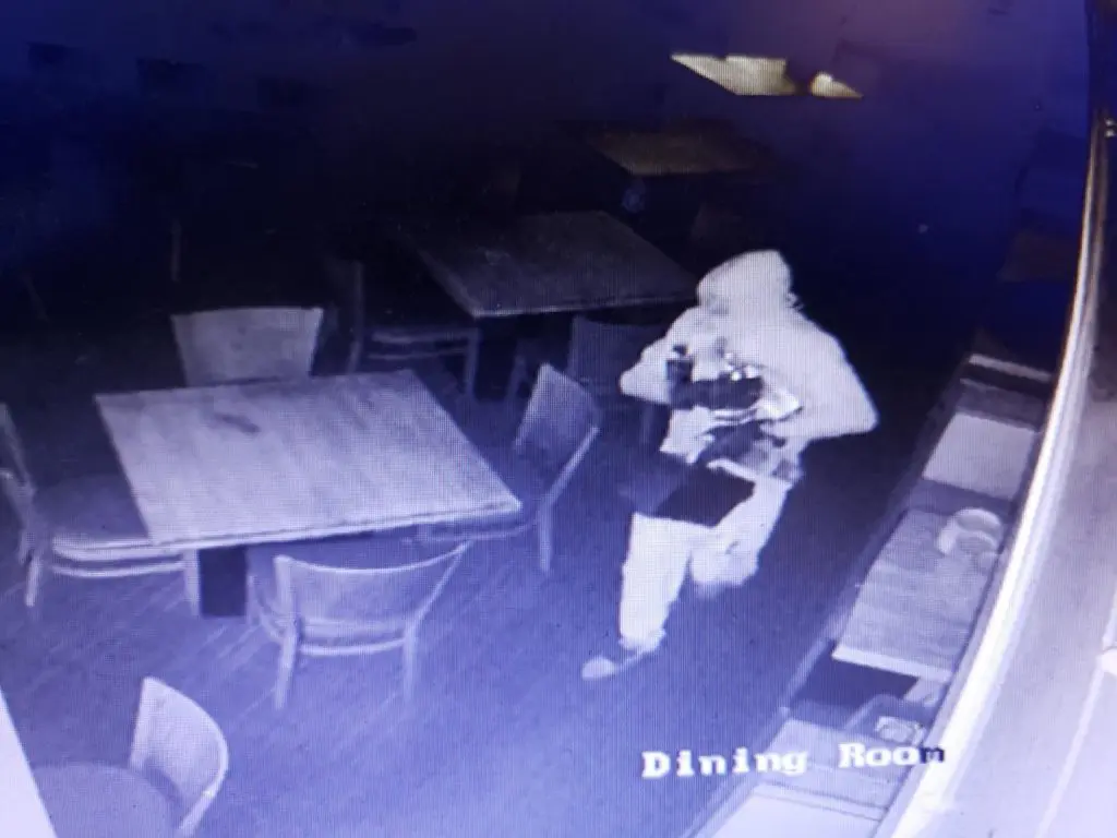 The burglar breaking into Frank's Americana Revival in the wee hours of Sunday morning.