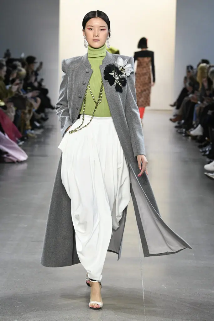Bibhu Mohapatra ash woolen cashmere sherwani over parrot green cashmere turtleneck and ivory crepe dhoti pants.(Photo by Yannis Vlamos/Indigital.tv)