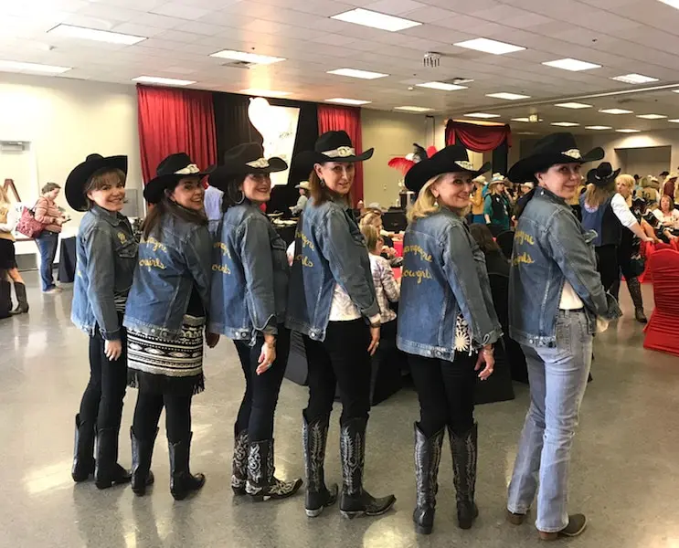 The Champagne Cowgirls showing off their team jackets in 2018.