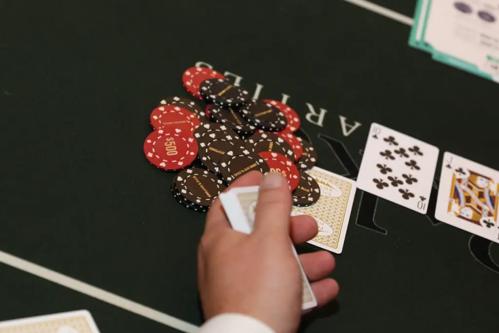 The dealer's hand at play in the Oil & Gas Texas Hold 'em Tournament (Photo by Priscilla Dickson)