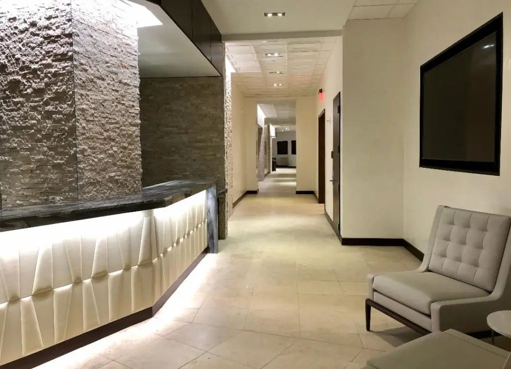 Inside the Founder's Lounge with suites along the hallway. (Photo by Courtney Dabney)