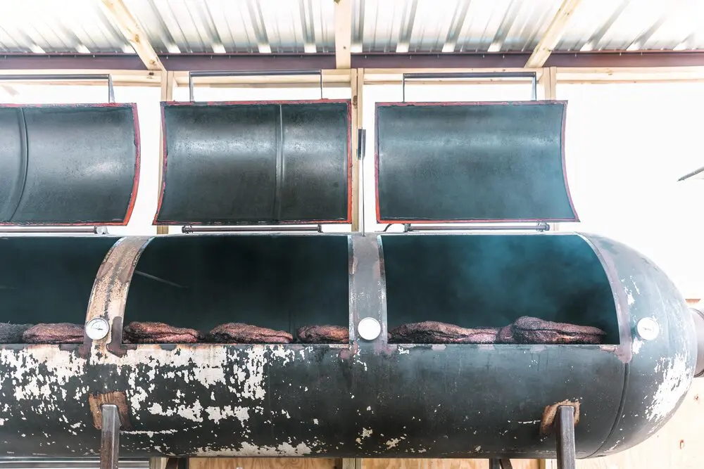 Rows of briskets smoking.