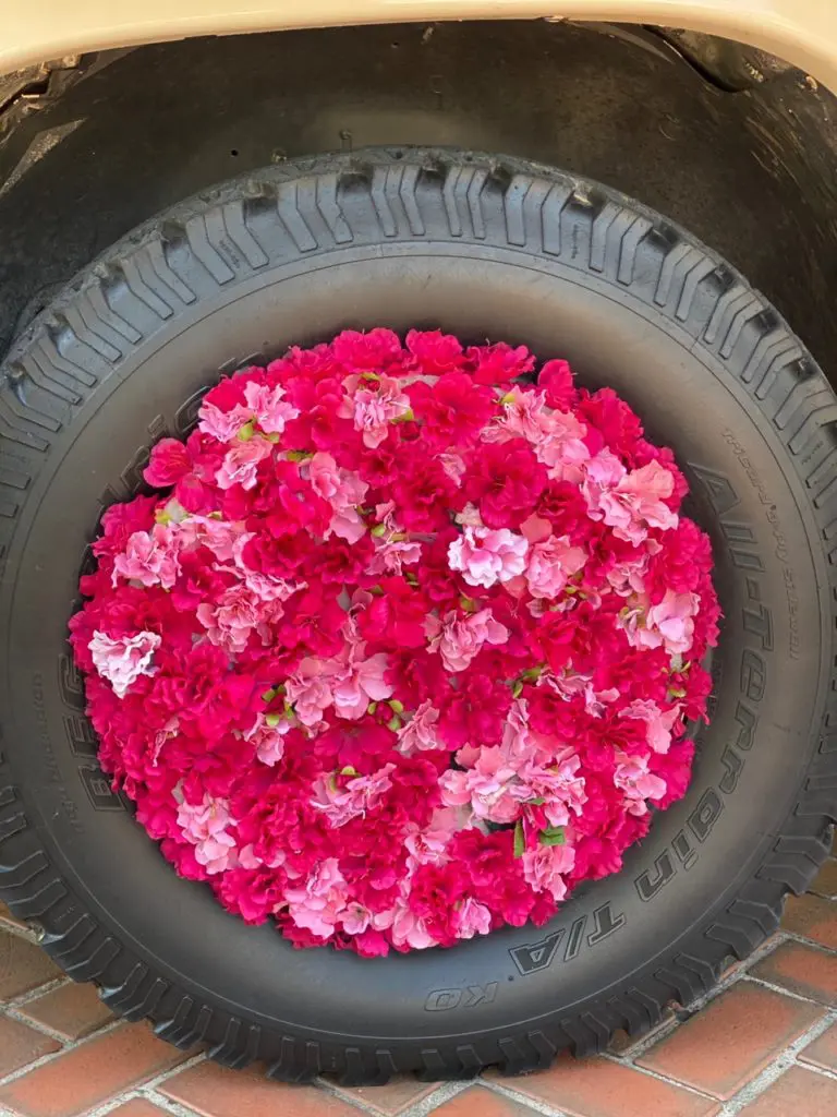 Even the tires of the Flower Mobile are bedecked in flowers. (Photo by Shelby Hodge)