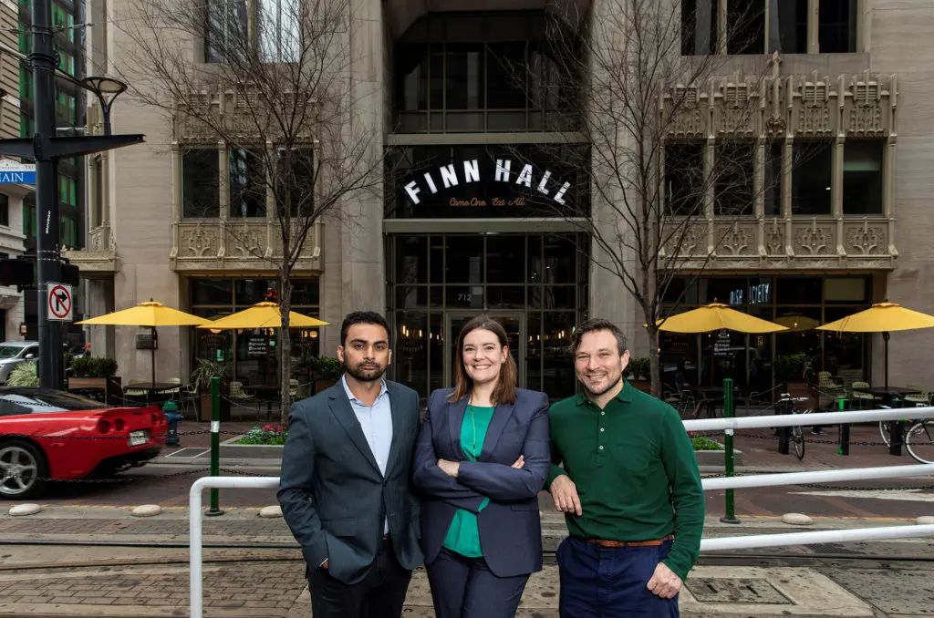 Lionstone Investments' Hunain Dada, Midway Companies' Miranda Cartwright,and culinary director David Buehrer at Finn Hall. (Photo by Julie Soefer Photography)