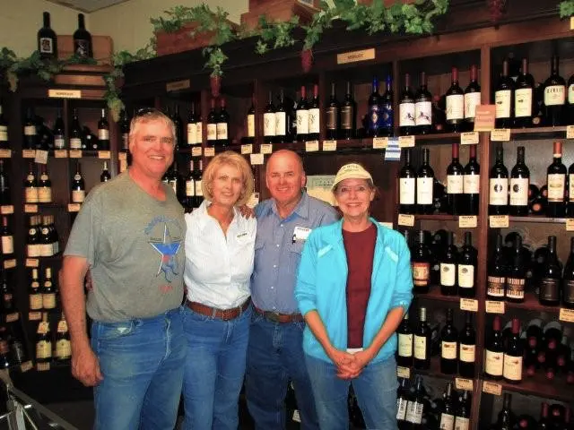 Owners, Renee and Bob Larance (center) from the seventieth anniversary celebration of Roy Pope's Grocery.