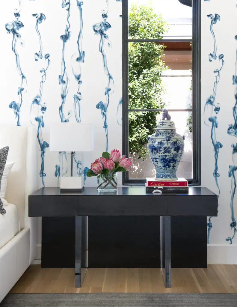 The master bedroom's Trove wallpaper features gray puffs of smoke. (Photo by Costa Christ Media)