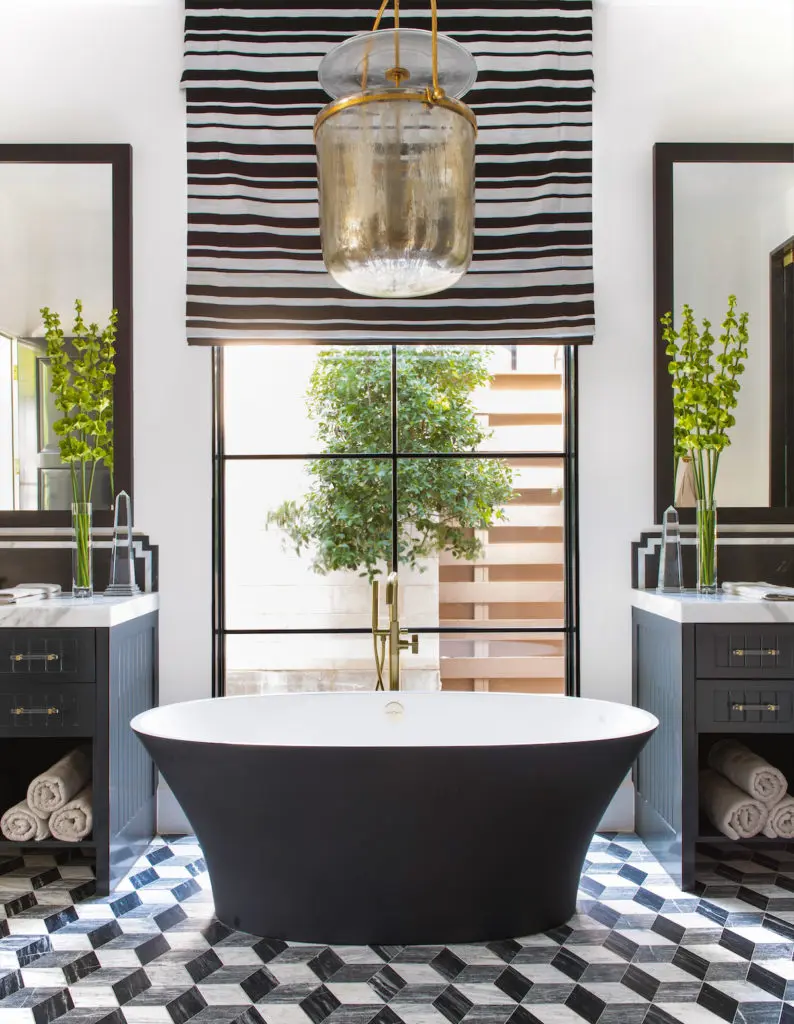 A Victoria + Albert tub custom-colored in black. Visual Comfort light pendant and shade with Perennials fabric. (Photo by Costa Christ Media)