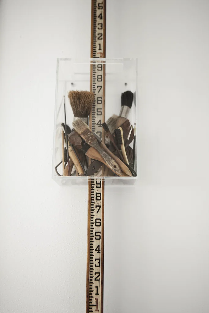 Claire Cusack, published September 2014. Photographed by Jenny Antill Clifton. In artist Claire Cusacks’ 1917 bungalow, the artist’s assemblage, "Paint by Numbers," 2013.
