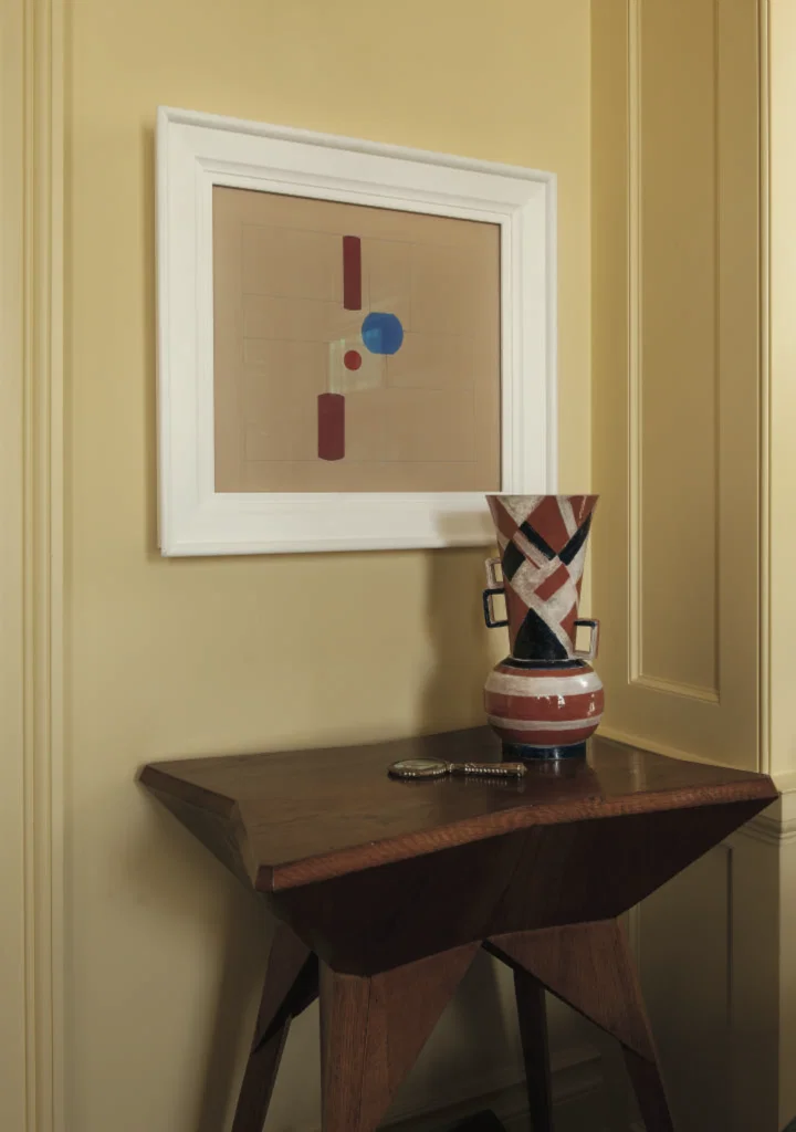 Mary Cullen and the late Roy Cullen, published January 2012. Interior design Michael J. Siller. Photographed by Jack Thompson. In Mary Cullen and the late Roy Cullen’s River Oaks home with its prized collection of Czech avant-garde art is a vignette in the library with a rare Cubist table by Vlastislav Hofman, 1912; a 1929 ceramic vase by Austrian talent Gudrun Baudisch; and a gouache on cardboard by Brazilian Helio Oiticica, "Seco #15," 1956.

