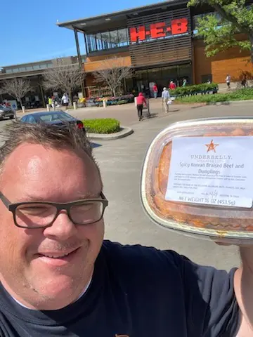 Underbelly Hospitality chef/owner Chris Shepherd proudly displays his restaurant offerings now being sold at H-E-B's across the city. (Courtesy photo)