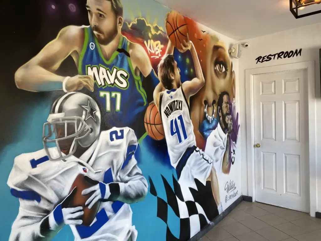 Inside the Invasion space, a mural of Dallas icons takes over a wall. (Courtesy of Invasion)