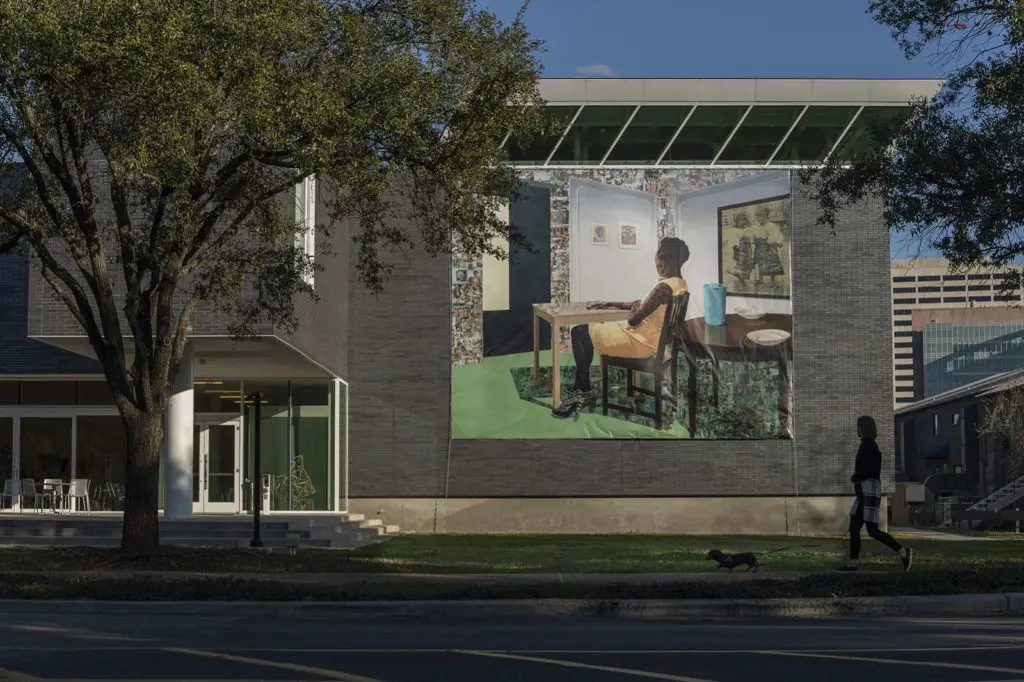 The Moody Center's contemporary African exhibition spills outside to engage campus visitors in the power of "Radical Revisionists." Shown, a banner based upon Njideka Akunyili Crosby's "In the Lavender Room," 2019. (Photo by Nash Baker)