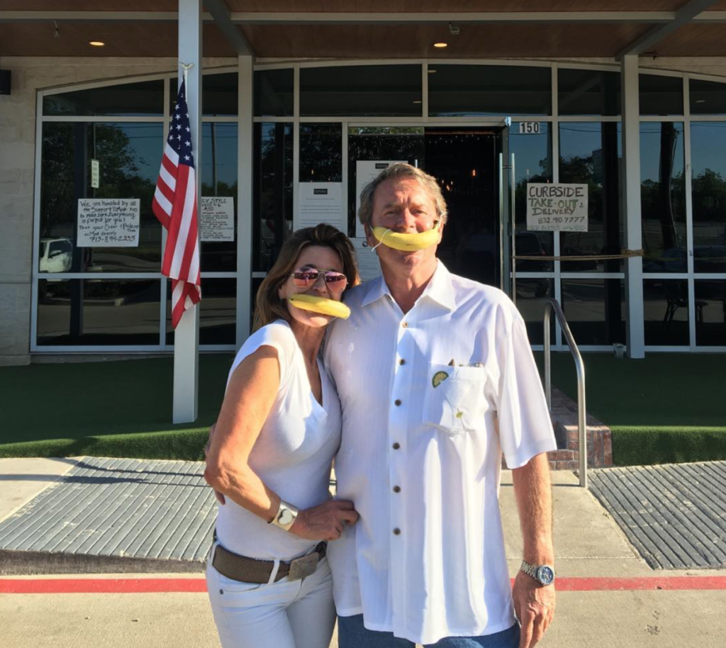 Annie Amante and Bennett Blocker in their 'banana' face masks, a riff on the county typo, at the reopening of the Federal American Grill. (Instagram photo)  