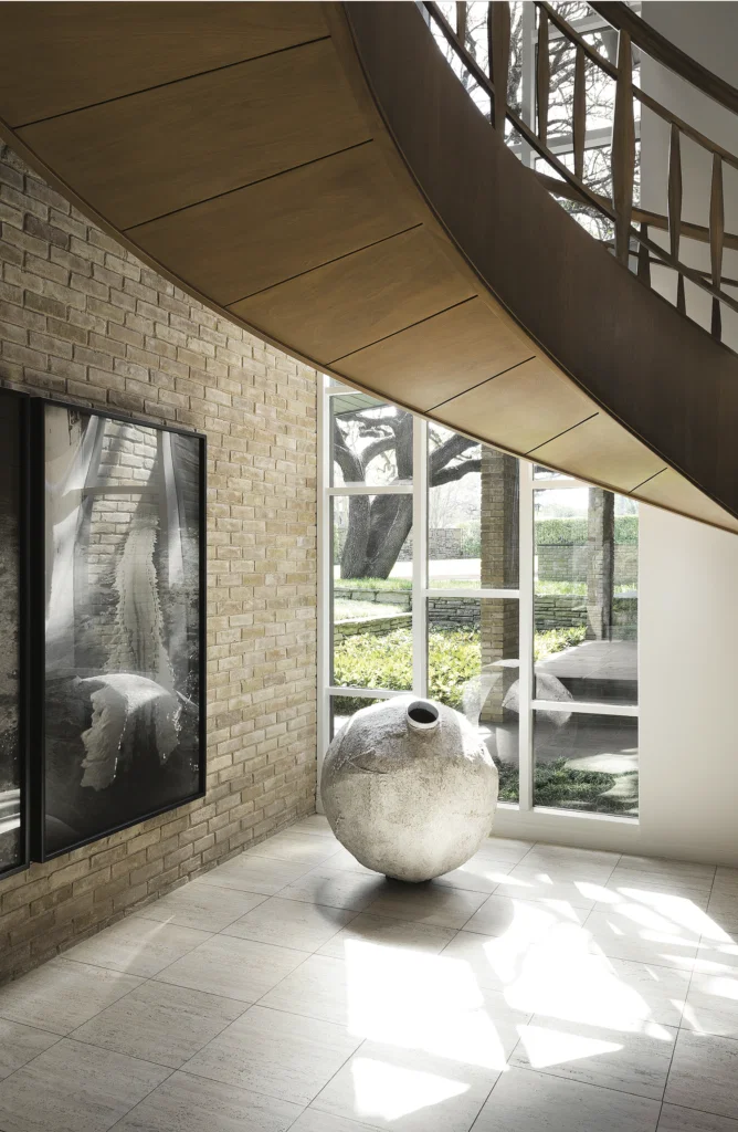 Sharon and Michael Young, published March 2017. Interior Design and Architectural Renovation Bodrun + Fruit. Photographed by Lisa Petrole. In art collectors Sharon and Michael Young’s 1961-era home in Dallas’s Preston Hollow, the magnolia-wood floating staircase is original to the house. Miroslaw Balka’s "Untitled," 2001. Hanging, Paul McCarthy’s "White Line Painted on the Floor with my Face," 1972. 