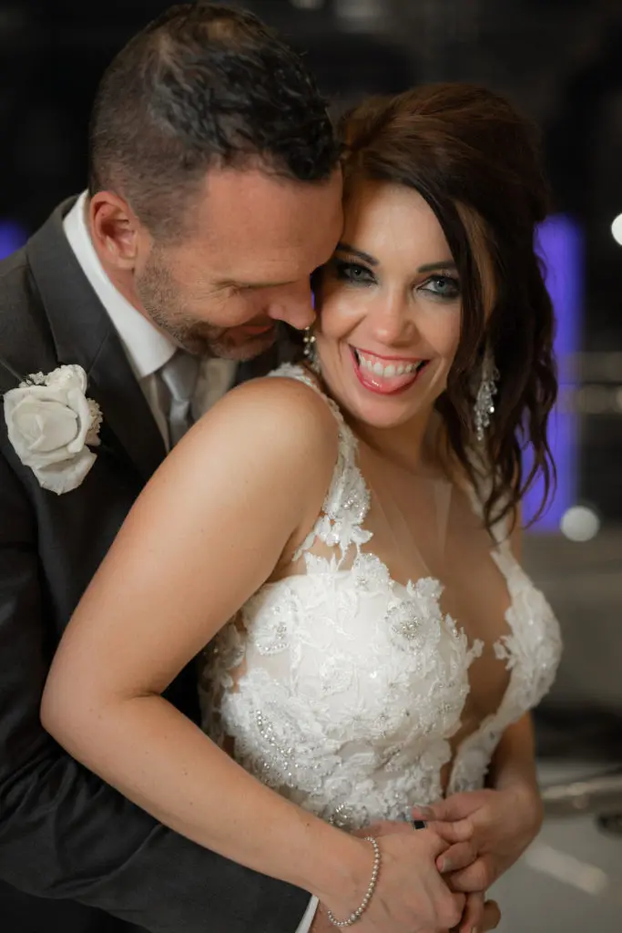 Mr. and Mrs. Clark Carroll share a loving moment on their wedding day at The Post Oak Hotel.  (Photo by Daniel Pawlowski, (www.theweddingshow.biz))