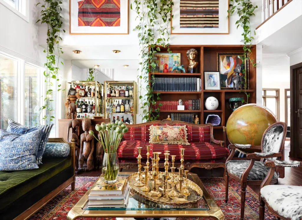 After a fire destroyed one of her husband's offices in Trophy Club, designer Judy Aldridge refurnished the living room with an antique sofa upholstered in vintage embroidered fabric from Guatemala. (Photo by Lisa Petrole)