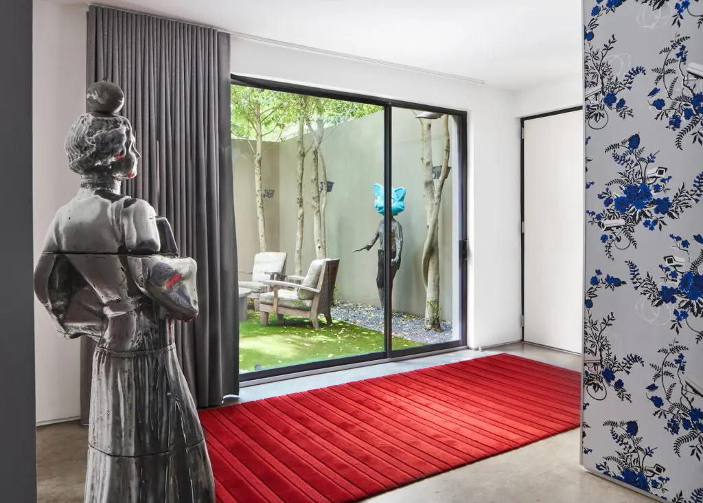 Sculptures in a luminous Knox-Henderson townhouse's courtyard and entry are by Elliot Eames Saarinen. (Photo by Stephen Karlisch)