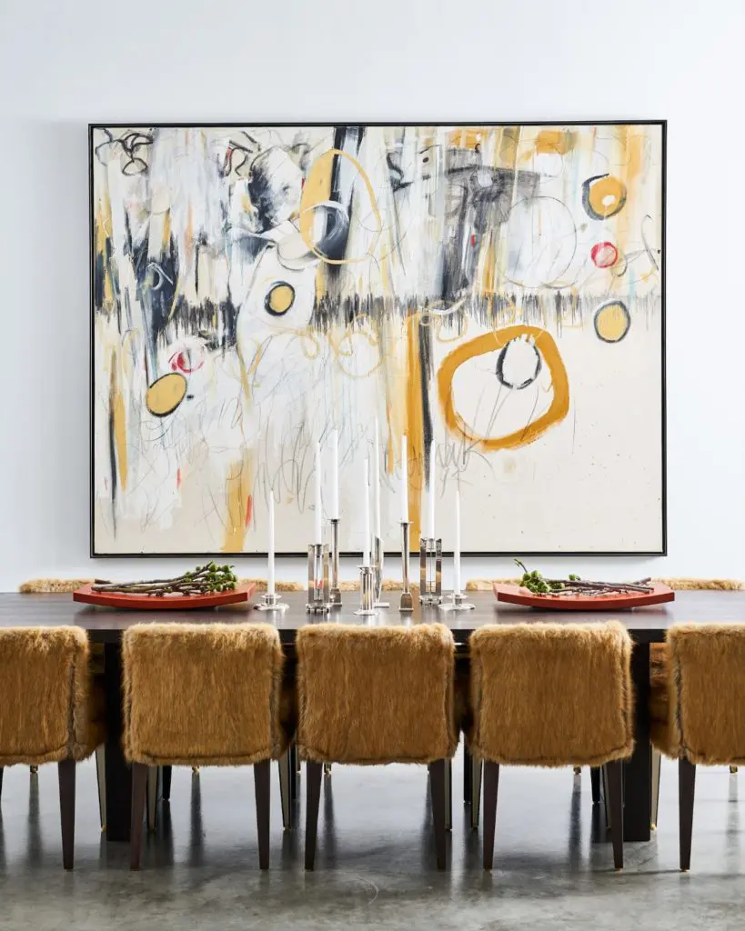 On the second level, the dining-room table and chairs are B&B Italia. 
Collection of sterling candlesticks, curated by
Russell Brightwell, includes designs by Richard Meier. (Photo by Stephen Karlisch)