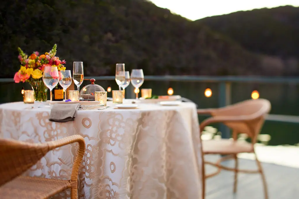 A romantic dinner on the resort deck will be a possibility when the spa re-opens July 1. (Photo by Lake Austin Spa Resort)
