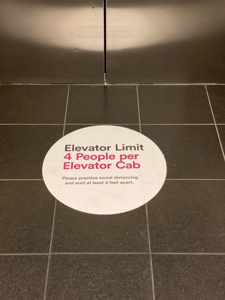 Signs indicate occupancy limits for elevators in The Galleria as part of the coronavirus precautions.  (Photo by Shelby Hodge)