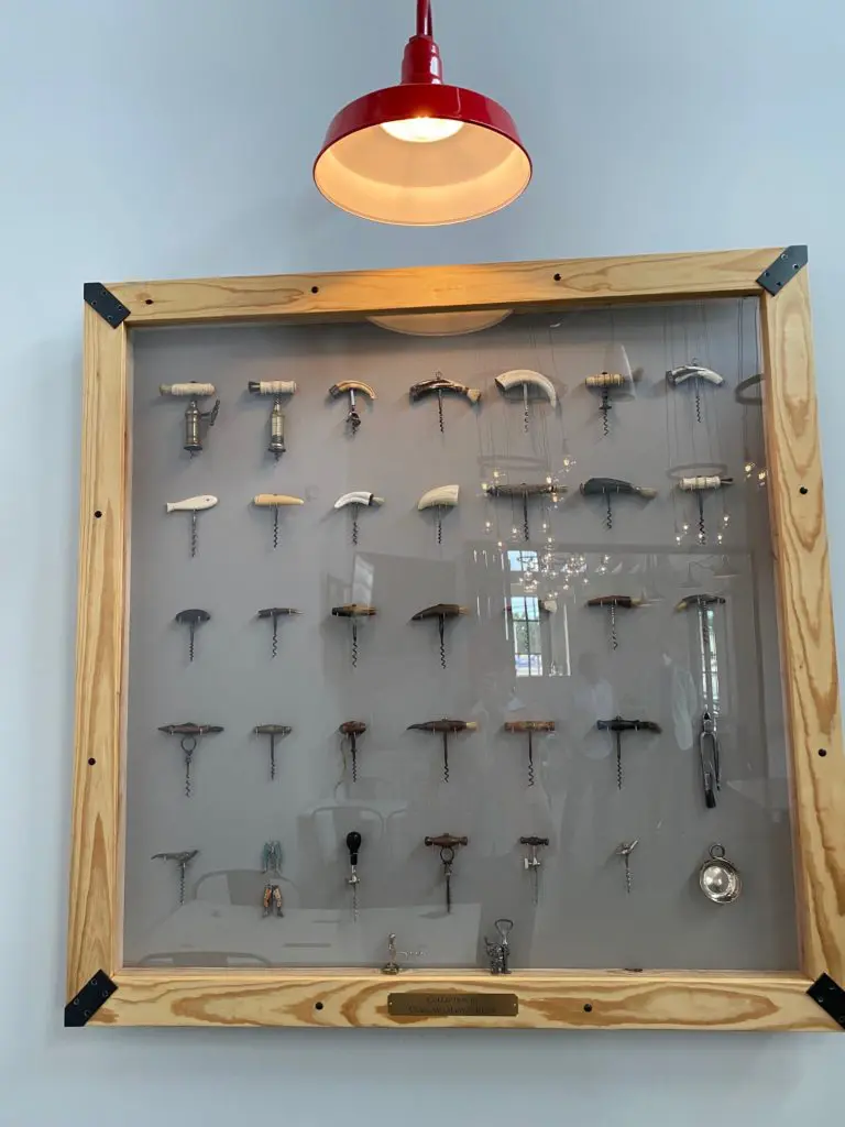 The Craig and Mary Jo Beyer cork collection adorns a wall in one of the two private dining rooms. (Photo by Shelby Hodge)