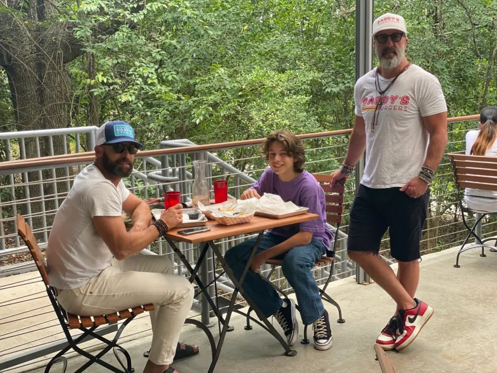 Greg Scheinman, left and his son Harper sample Grant Cooper's take on hamburgers at Daddy's Burgers.